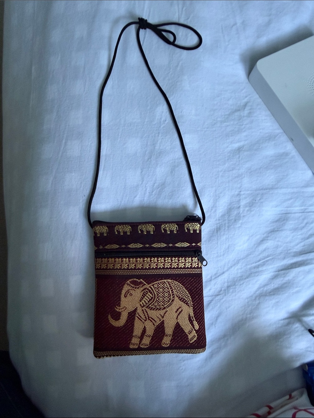 Gold Elephant Crossbody Bag on Burgundy Canvas